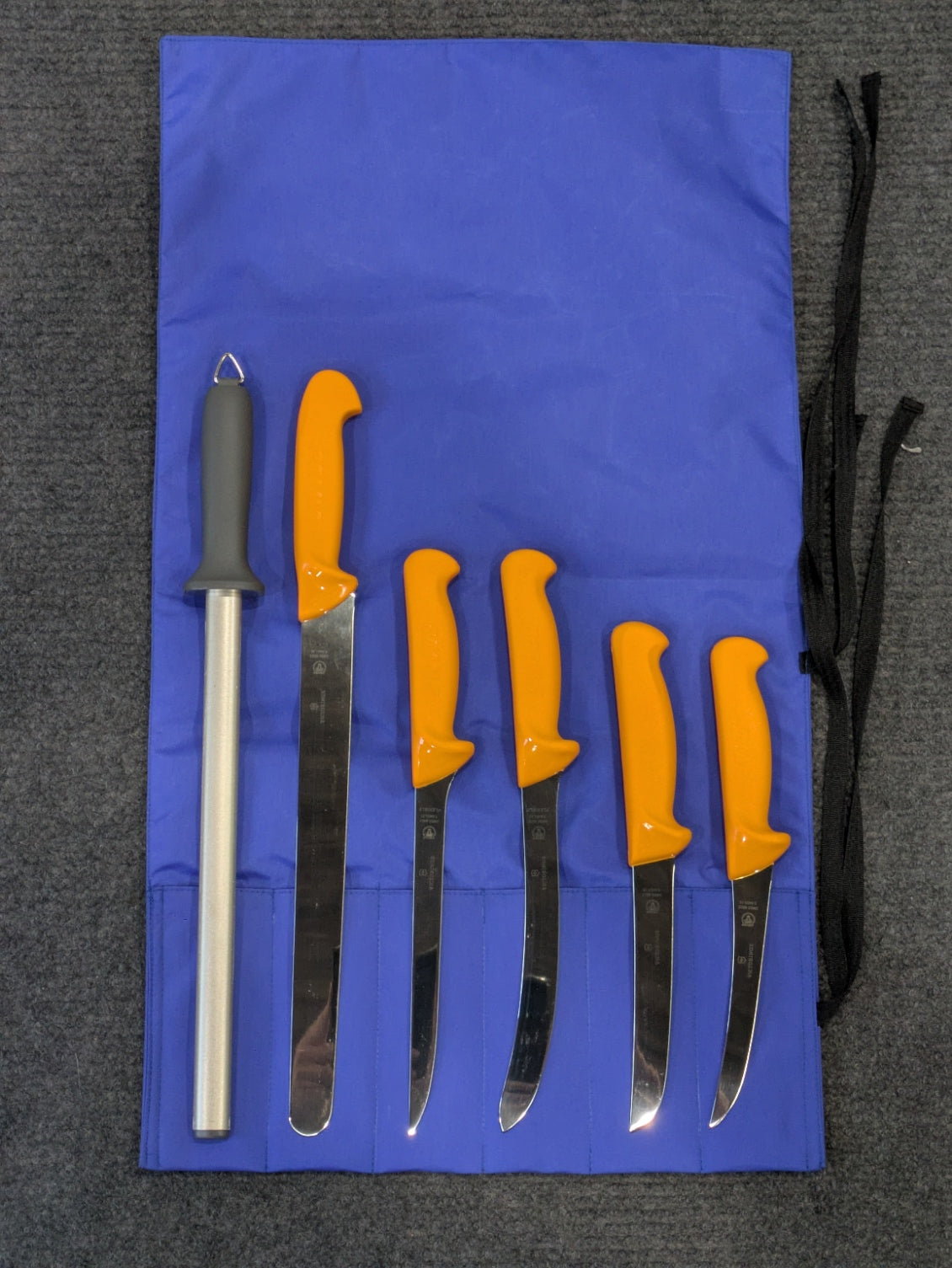 Swibo fishing knife roll set — fillet, boning and slicing knives laid out in a nylon roll
